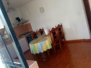 a kitchen with a table and chairs in a room at Tonishka Villa in Trou aux Biches