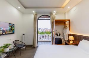 Postel nebo postele na pokoji v ubytování Olagi Hotel 2