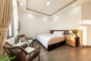 Postel nebo postele na pokoji v ubytování Olagi Hotel 2