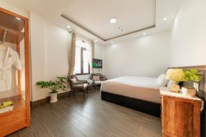 Postel nebo postele na pokoji v ubytování Olagi Hotel 2