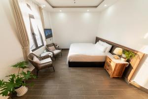 Postel nebo postele na pokoji v ubytování Olagi Hotel 2