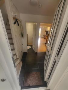 a hallway of a house with a staircase and a hallway at Fichtenstüble in Todtmoos