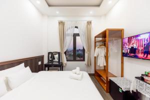 Postel nebo postele na pokoji v ubytování Olagi Hotel 2
