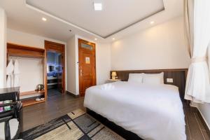 Postel nebo postele na pokoji v ubytování Olagi Hotel 2