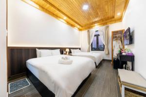 Postel nebo postele na pokoji v ubytování Olagi Hotel 2