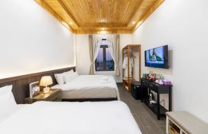 Postel nebo postele na pokoji v ubytování Olagi Hotel 2