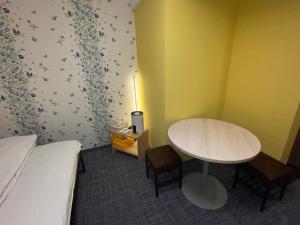 Postel nebo postele na pokoji v ubytování GuestHouse Guu