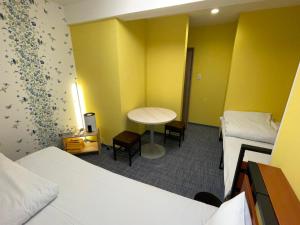 Postel nebo postele na pokoji v ubytování GuestHouse Guu