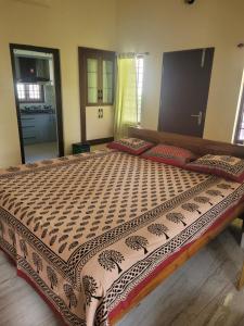 a bedroom with a large bed in a room at Most Spacious Stay in Shānti Niketan