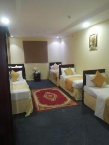 Giường trong phòng chung tại فندق قيروان المشاعر