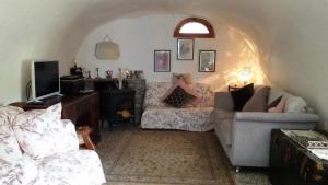 a living room with a couch and a chair at Cozy Cottage Retreat in Bajardo in Baiardo +84 photos