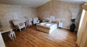 Postel nebo postele na pokoji v ubytování B&B Villa Fiorini + 37 fotografií