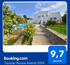 a villa with a swimming pool and a house at Apartments in a "VILLA VISTA JAVEA" in Jávea