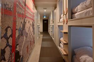 Postel nebo postele na pokoji v ubytování Hotel Tomariya Ueno