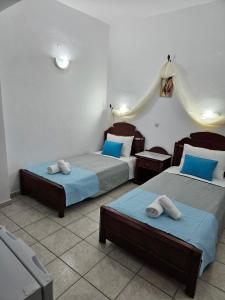 Ένα ή περισσότερα κρεβάτια σε δωμάτιο στο Hotel Leta 