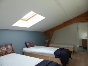 Ένα ή περισσότερα κρεβάτια σε δωμάτιο στο Ohaïna Villa & Suites - Piscine chauffée - 4km de la plage