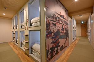 Postel nebo postele na pokoji v ubytování Hotel Tomariya Ueno