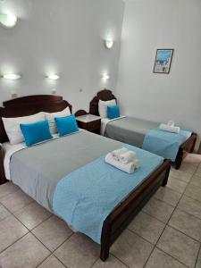 Ένα ή περισσότερα κρεβάτια σε δωμάτιο στο Hotel Leta 