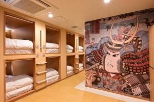 Postel nebo postele na pokoji v ubytování Hotel Tomariya Ueno