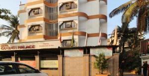 a building with a car parked in front of it at HOTEL GOLDEN PALACE PVT LTD in Mumbai