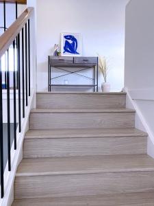 a staircase in a home with wooden floors at Happy life in Schofields