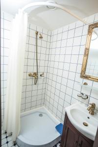 a bathroom with a tub and a sink at Alatskivi Castle in Alatskivi