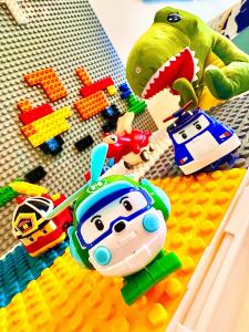 a toy figurines of toy cars and a toy turtle at Legoland-Happy Wonder Love Suite-Elysia- Max8pax-with Garden-Pool view in Nusajaya