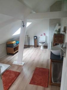 a bathroom with a sink and a toilet in a room at Charmante maison au bord des falaises in Les Authieux-sur-le-Port-Saint-Ouen +29 photos