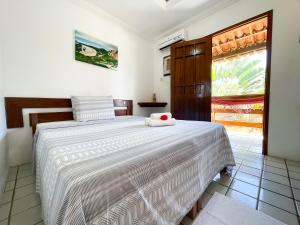 Giường trong phòng chung tại Pousada Lua Cheia