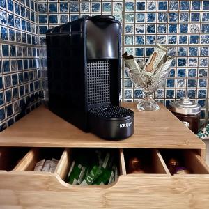 a coffee maker sitting on top of a wooden shelf at G & A APARTMENT in Orestiada