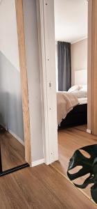a bedroom with a mirror and a bed in it at Luxury Mountain Apt with Sauna in Narvik