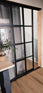 a sliding glass door in a room with a window at Luxury Mountain Apt with Sauna in Narvik