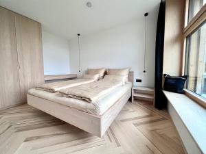 Postel nebo postele na pokoji v ubytování Luxusappartement hôamele - Ferienwohnung mit Genuss