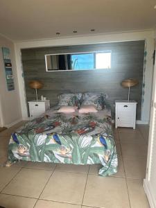 En eller flere senge i et værelse på L’Oasis Saint Bernard