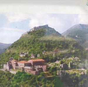 a village on a hill with a mountain at HELLAS PALACE ROOM PRIVATE in Sparta