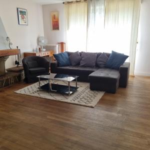 Posezení v ubytování Spacieux Appartement RDC tout confort