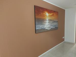 a painting hanging on a wall in a room at Casina Arianna in Leverano