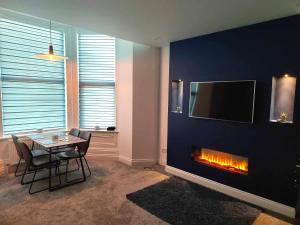 TV a/nebo společenská místnost v ubytování Antrim Holiday Apartment