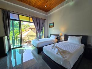 Postel nebo postele na pokoji v ubytování Baan Koh Kwang Pool Villa Krabi + 37 fotografií