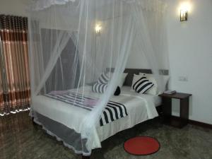 Postel nebo postele na pokoji v ubytování Wow Home Stay