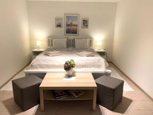 Posteľ alebo postele v izbe v ubytovaní Pommedi Apartman