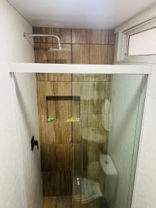 a shower with a glass door in a bathroom at Apartamento céntrico Frida's todo nuevo in Tarija