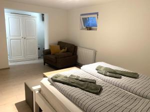 Posteľ alebo postele v izbe v ubytovaní Pommedi Apartman