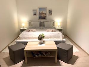 Posteľ alebo postele v izbe v ubytovaní Pommedi Apartman
