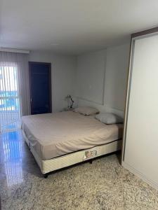 a bedroom with a bed in a room at Casa do Vô Luiz in Vila Velha