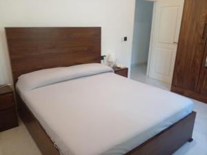 Vuode tai vuoteita majoituspaikassa Villa Dario