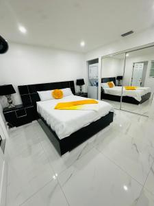 a bedroom with two beds and a large mirror at Green planet in Naples