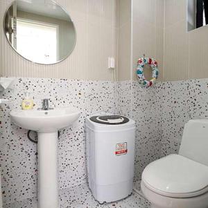 a bathroom with a sink and a toilet and a mirror at private swimming pool near dasan beachroom in Namyangju