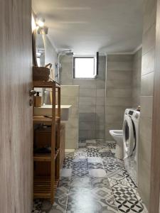 a bathroom with a toilet and a sink at Aegina seaview home in Aegina Town +39 photos
