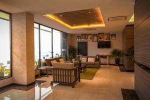 a lobby of a hotel with a waiting room at D Elegance Hotel in Nusajaya